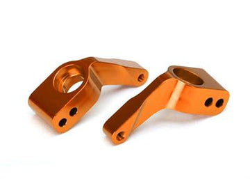 Traxxas - TRX3652T - Stub axle carriers, Rustler®/Stampede®/Bandit (2), 6061-T6 aluminum (orange-anodized)/ 5x11mm ball bearings (4)