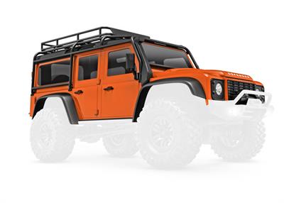 Traxxas - TRX9712-ORNG - Body, Land Rover® Defender®, complete, orange (includes grille, side mirrors, door handles, fender flares, fuel canisters, j